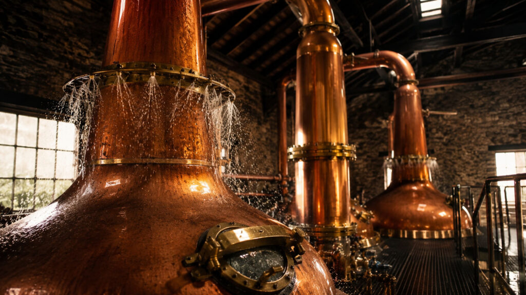 Copper pot stills at Fettercairn Distillery featuring the signature cooling ring.